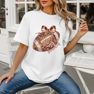 🏈 Sparkle & Spike: Gold Glitter Football Bow t-shirt. Touch down game ready